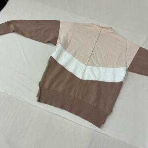 Colorblock knit sweater featuring neutral beige, cream, and mocha tones